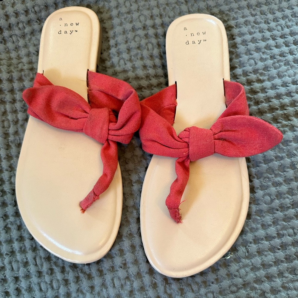 Deep orange bow flip flops